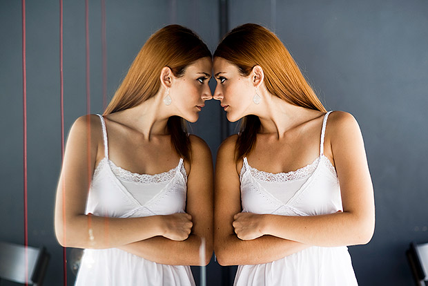 Woman staring at herself in the mirror